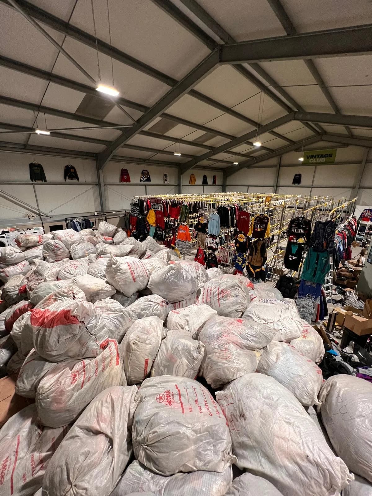 Our second warehouse: a mountain of bales in front of the rails